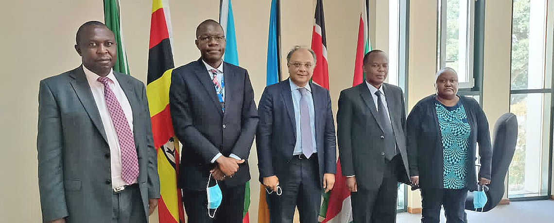 Chairperson of the EAC Coordinating Committee, Dr. Kevit Desai (c) visits the EAC Competition Authority during a working visit to the EAC Headquarters in Arusha, Tanzania.